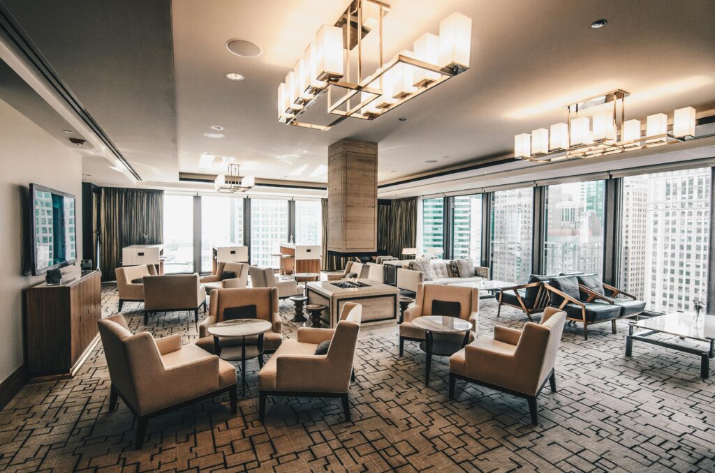 Spacious, modern hotel lounge area with a cityscape view in Chicago, featuring stylish furniture.